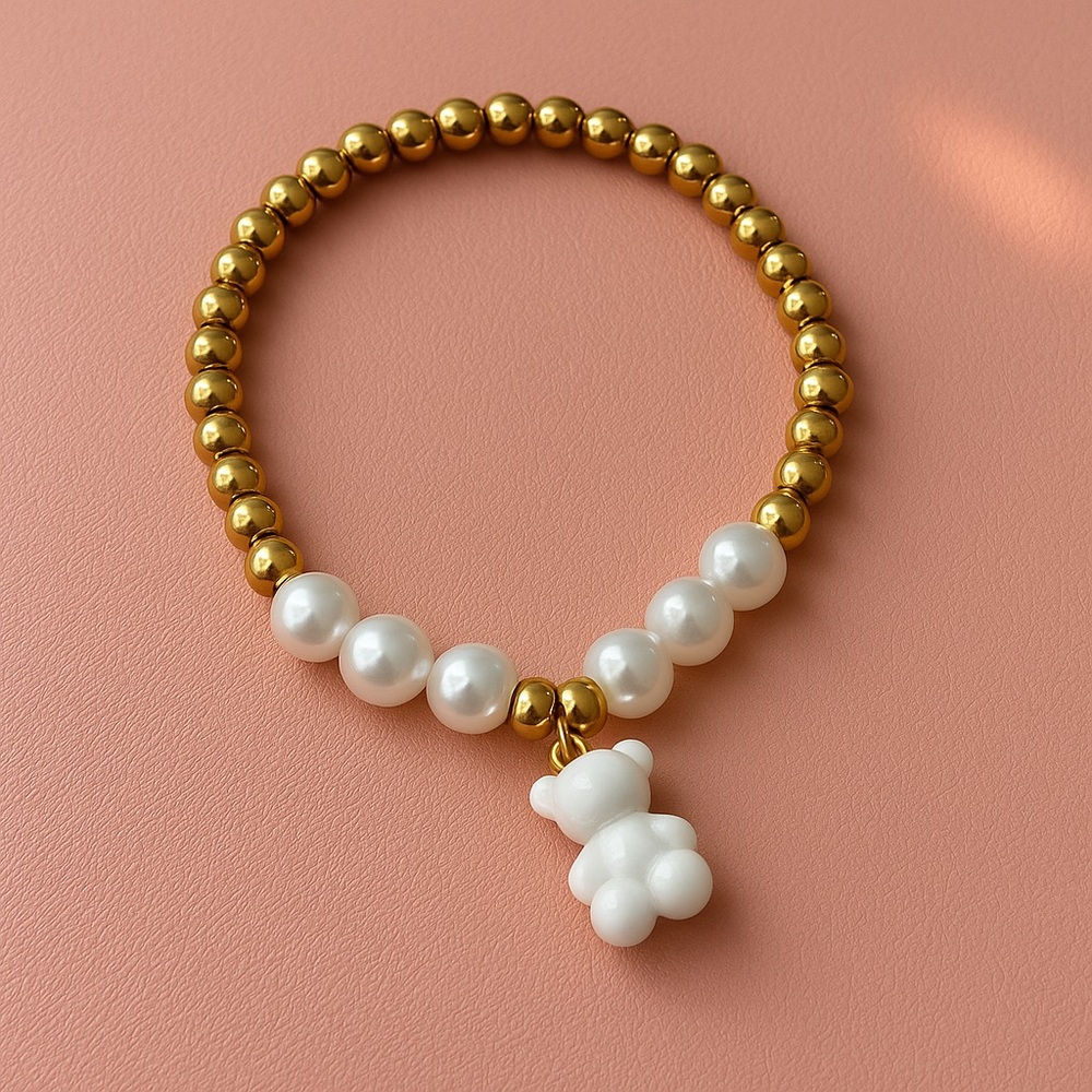 Gold and White Beaded Bracelet with Bear Charm